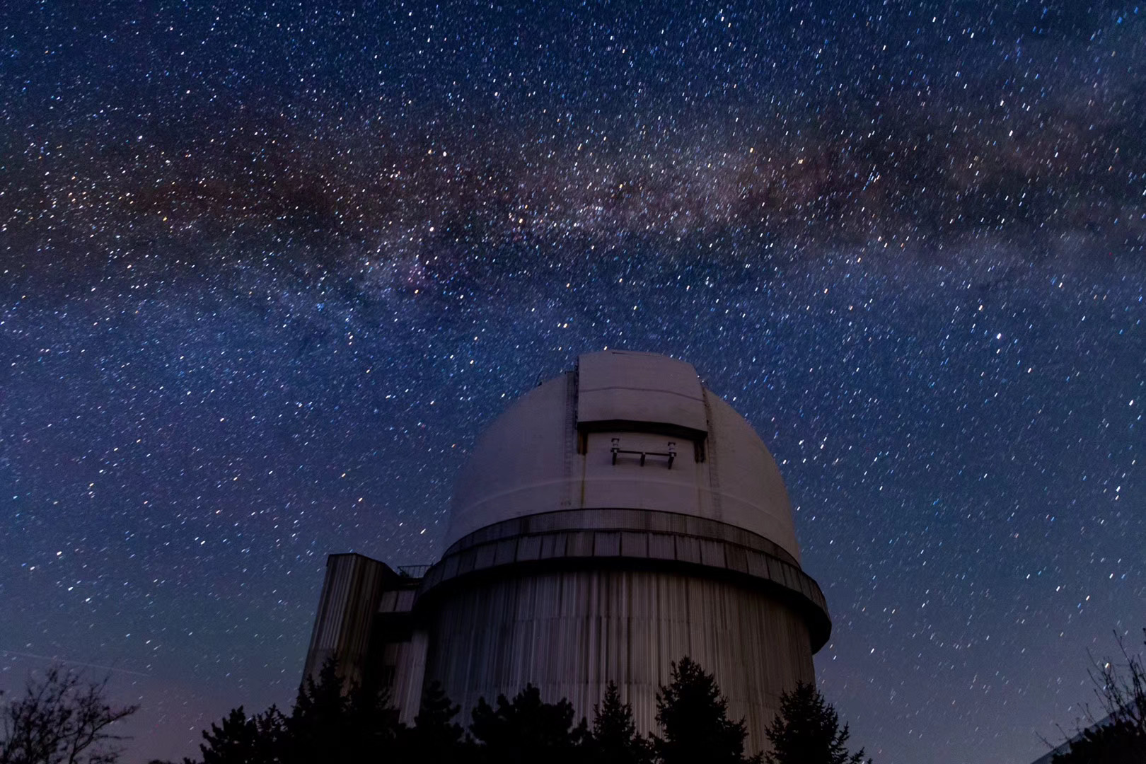 Starry sky over an observatory